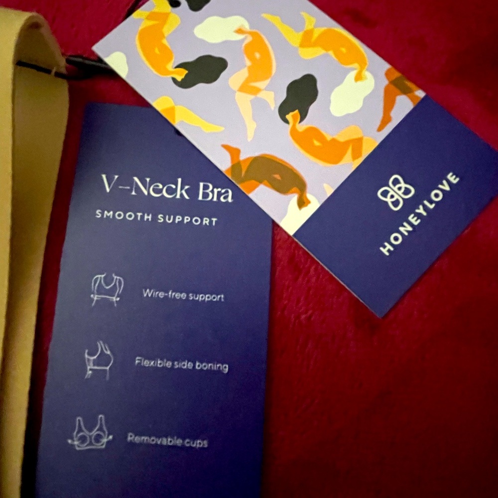 Supportive microfabric, bonded bust support, and a hardware-free design